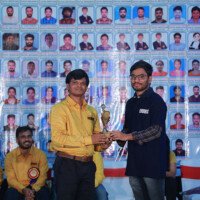 A proud moment as faculty honors a student for outstanding performance – Testimonials from Hyderabad's best coaching institute. Faculty member giving award to student during testimonial event at Hyderabad best coaching center