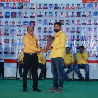 Director Srinivasulu Reddy Sir presenting an award to a student during the testimonials ceremony at Everest Coaching Point. Director giving award to student during testimonials event at Everest Coaching Point