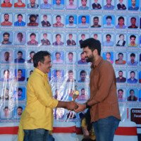 Maths Sir presenting an award to a student during the testimonials ceremony at Everest Coaching Point. Maths Sir giving award to student during testimonials event at Everest Coaching Point