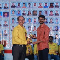 Jan’s Sir presenting an award to a student during the testimonials event at Everest Coaching Point. Jan’s Sir giving award to student during testimonials event at Everest Coaching Point