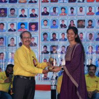 Jain Sir presenting an award to a student during the testimonials event at Everest Coaching Point. Jain Sir giving award to student during testimonials event at Everest Coaching Point