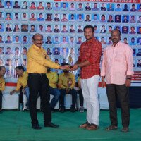 Director Srinivasulu Reddy Sir awarding a student during the testimonials event at Everest Coaching Point. Director Srinivasulu Reddy Sir giving award during testimonials event at Everest Coaching Point
