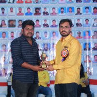 Maths Sir Rajkumar presenting an award to a student during the testimonials event at Everest Coaching Point. Maths Sir Rajkumar giving award to student during testimonials event at Everest Coaching Point