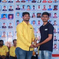 A proud moment as a faculty sir awards a student during the testimonials ceremony at Everest Coaching Point. Faculty sir giving award to student during testimonials event at Everest Coaching Point