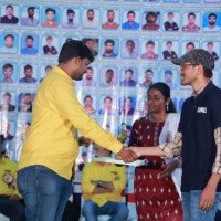 A heartfelt moment shared between a faculty member and a student during the testimonials event. Faculty member sharing moment with student during testimonials event at Everest Coaching Point