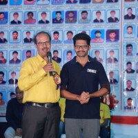 Jain Sir delivering a speech alongside a student during the testimonials ceremony. Jain Sir giving speech with student during testimonials event at Everest Coaching Point