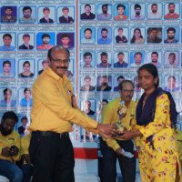 Director Srinivasulu Reddy Sir presenting an award to a lady student during the testimonials ceremony. Director Srinivasulu Reddy Sir giving award to lady student during testimonials event at Everest Coaching Point