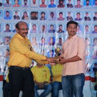 Director Srinivasulu Reddy Sir presents an award to a successful job holder during the testimonials event. Director Srinivasulu Reddy Sir giving award to job holder during testimonials event at Everest Coaching Point