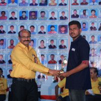Director Srinivasulu Reddy Sir awarding a student during the testimonials event. Director Srinivasulu Reddy Sir giving award to student during testimonials event at Everest Coaching Point
