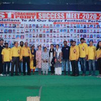 A group photo featuring staff members and students united during the testimonials event. Group photo of staff and students at testimonials event at Everest Coaching Point