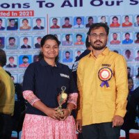 Maths faculty poses with a student during the testimonials celebration. Maths sir with student during testimonials program at Everest Coaching Point