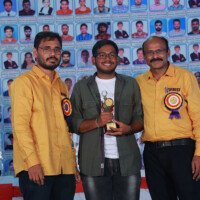 Director Srinivasulu Reddy Sir, Maths faculty, and a student together at the testimonials event. Director Srinivasulu Reddy, Maths sir, and student posing together during testimonials event at Everest Coaching Point