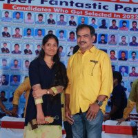 Our maths faculty member presents an award to a student during the testimonials ceremony. Maths teacher giving award to student during testimonials event at Everest Coaching Point