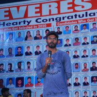 A confident student addressing the audience during a speech – photo gallery highlight. Boy delivering a speech on stage, featured in the photo gallery.