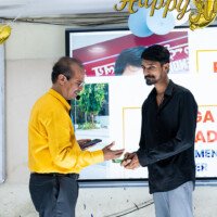 Jains Sir of Everest Coaching Point presenting award to a successful student Jains Sir giving award to student – testimonials of excellence