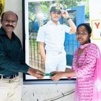 Everest Coaching Point Director presenting award to a student Director Sir giving award to student – testimonials of excellence