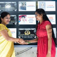Laxmi Ma’am of Everest Coaching Point awarding a student Laxmi Ma’am presenting award to student – testimonials of achievement
