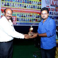 Testimonial – Director Giving Award to Student Director presenting award to student – Testimonial moment at Everest Coaching Point
