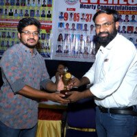Faculty member awarding a successful student at Everest Coaching Point Faculty giving award to student – testimonials of academic excellence