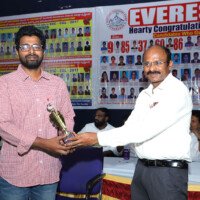 Director Srinivas Lulu Sir presenting award to a successful student Director Sir giving award to student – testimonials of success and recognition