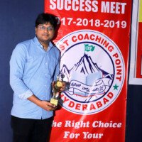 Everest Coaching Point student proudly holding their award Student holding award – testimonials of dedication and success