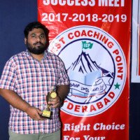Everest Coaching Point student proudly holding an award Student holding award – testimonials of success and achievement