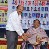 Director Srinivas Lulu Sir awarding a person at Everest Coaching Point Director Sir giving award – testimonials of honour and recognition